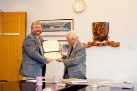 Dr. Storey presenting Certificate of Appreciation to Mr. T.C. Lai